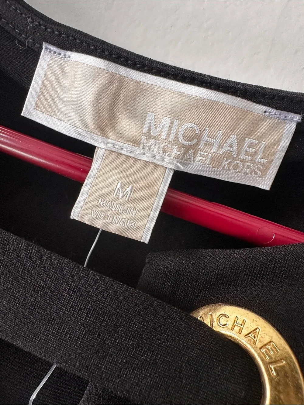 Michael Kors Black Long-Sleeve Mini Dress with Gold Grommet Detail